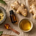Flacon d’huiles essentielles de gingembre et racines fraîches